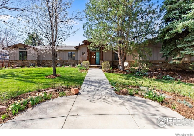 1533 Old Tale Rd, Boulder, CO 80303 - view of front facade featuring a front lawn and board and batten siding