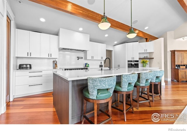 1533 Old Tale Rd, Boulder, CO 80303 - kitchen featuring a sink, light wood-style flooring, and backsplash