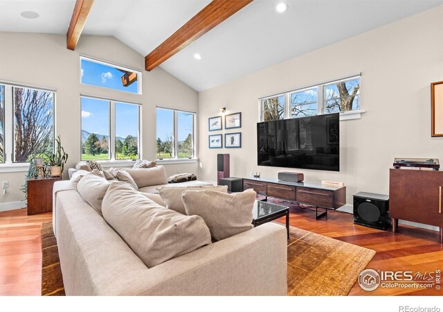 1533 Old Tale Rd, Boulder, CO 80303 - living room featuring wood finished floors, beam ceiling, baseboards, high vaulted ceiling, and recessed lighting
