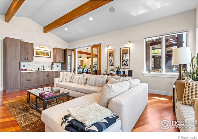 1533 Old Tale Rd, Boulder, CO 80303 - living room with baseboards, lofted ceiling with beams, and light wood-style flooring