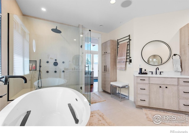 1533 Old Tale Rd, Boulder, CO 80303 - bathroom featuring a freestanding tub, a shower with shower door, vanity, and tile patterned floors
