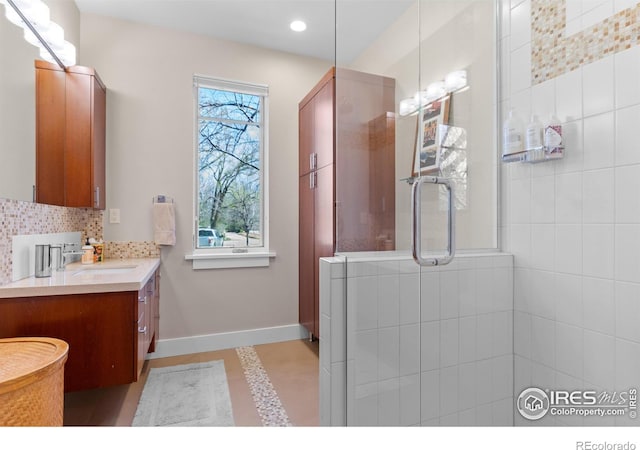 1533 Old Tale Rd, Boulder, CO 80303 - full bath featuring tasteful backsplash, a tile shower, baseboards, vanity, and recessed lighting
