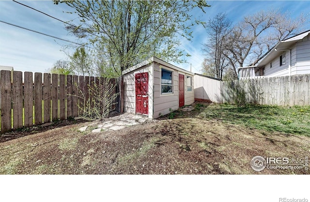 view of outbuilding with an outdoor structure and a fenced backyard