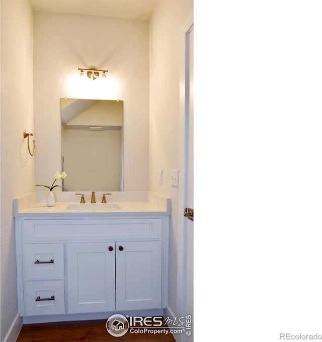 bathroom featuring vanity and baseboards