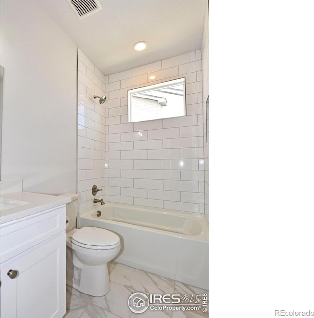 bathroom featuring vanity, shower / bath combination, toilet, and marble finish flooring