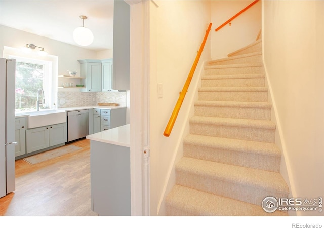 1114 5th Ave, Longmont, CO 80501 - staircase featuring wood finished floors