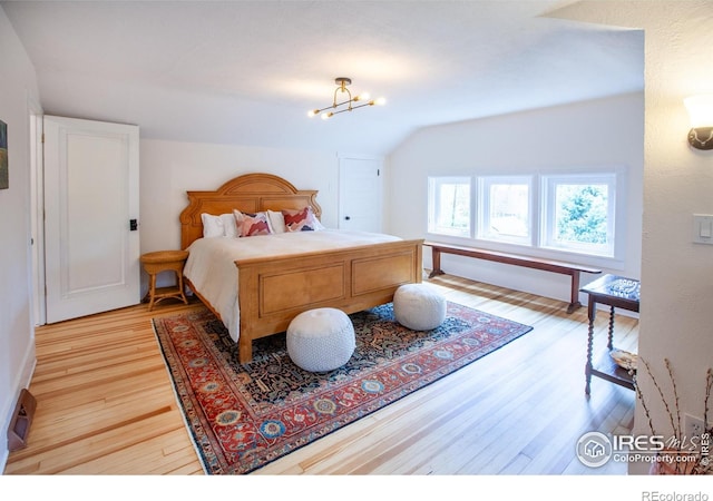 1114 5th Ave, Longmont, CO 80501 - bedroom featuring baseboards, lofted ceiling, and light wood-style floors