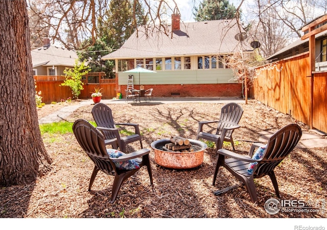 1114 5th Ave, Longmont, CO 80501 - view of patio / terrace featuring a fenced backyard and a fire pit