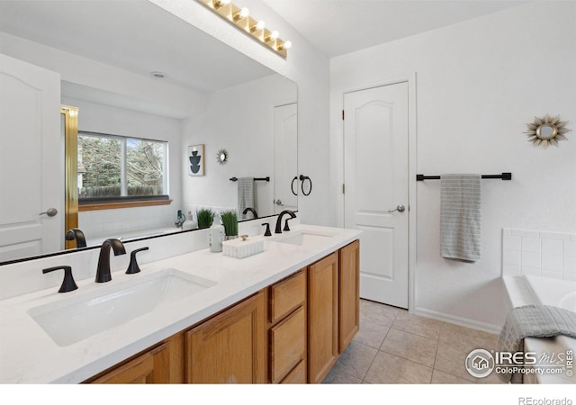 bathroom featuring a sink, tile patterned floors, a bath, and double vanity