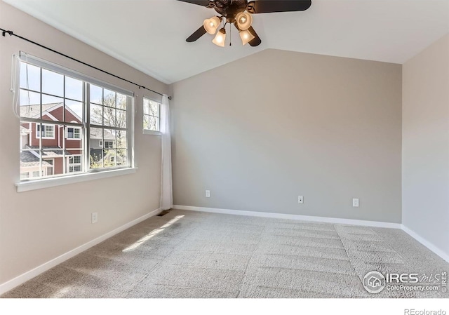 unfurnished room featuring a ceiling fan, visible vents, vaulted ceiling, baseboards, and carpet flooring