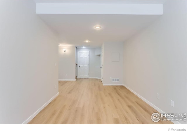 hallway featuring recessed lighting, baseboards, light wood-type flooring, and visible vents