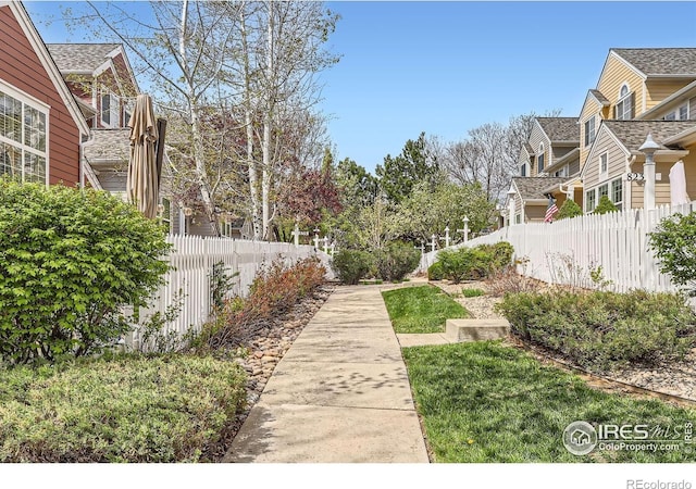 surrounding community featuring fence