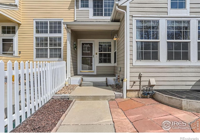 doorway to property with fence