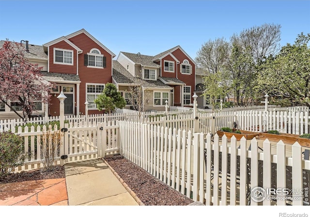 view of front of house with a gate and a fenced front yard