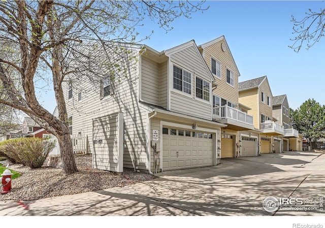 view of property with an attached garage and driveway