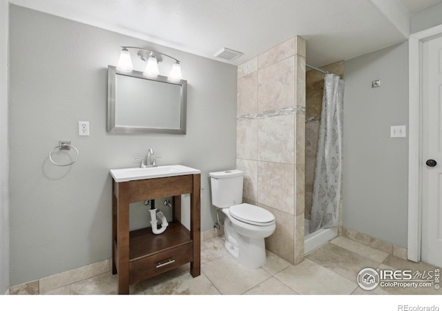 bathroom with visible vents, a shower stall, vanity, baseboards, and toilet