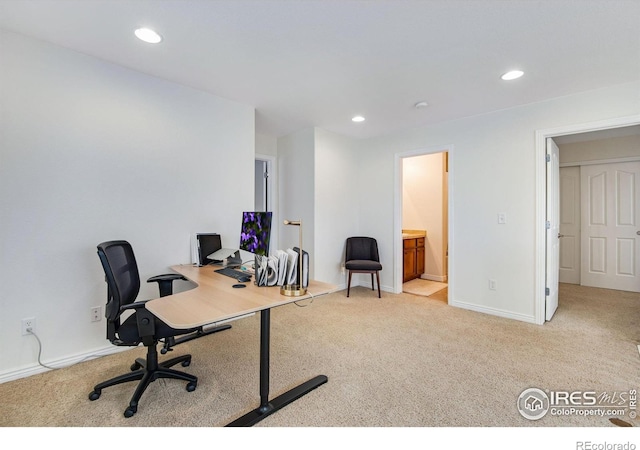carpeted office with recessed lighting and baseboards