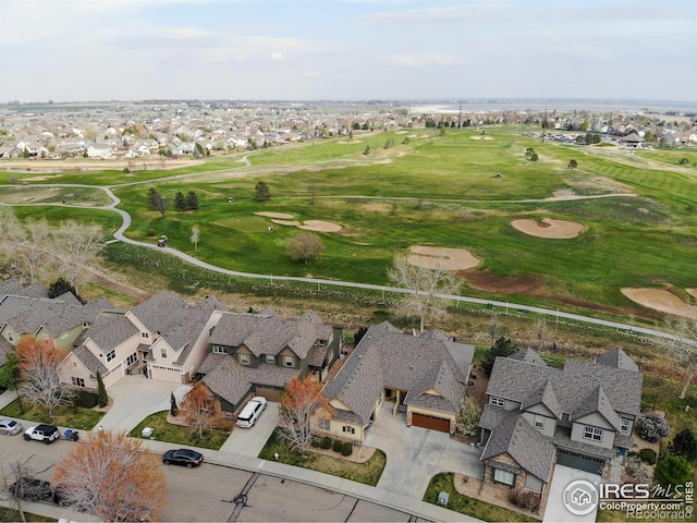 bird's eye view with golf course view and a residential view