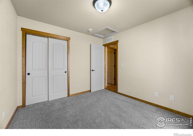 7056 Langland St, Wellington, CO 80549 - unfurnished bedroom featuring baseboards, carpet floors, a closet, and attic access