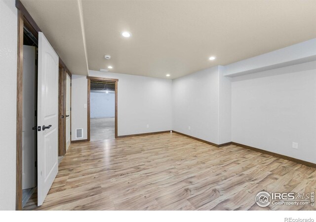 7056 Langland St, Wellington, CO 80549 - finished basement featuring light wood-type flooring, baseboards, and recessed lighting