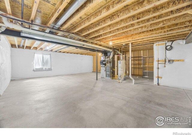 7056 Langland St, Wellington, CO 80549 - below grade area featuring gas water heater and heating unit