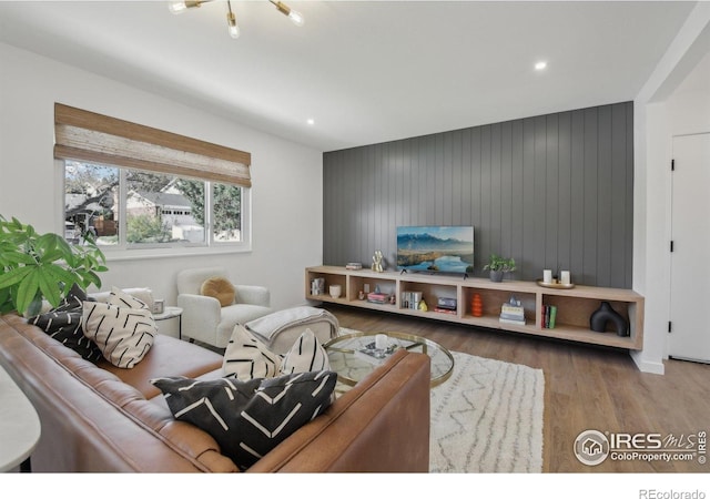 living room with recessed lighting and wood finished floors