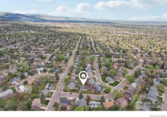 birds eye view of property with a residential view and a mountain view