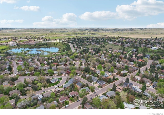 aerial view featuring a residential view and a water view