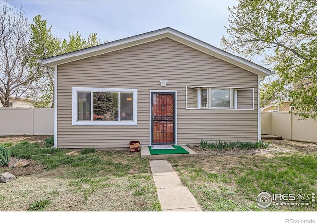 214 2nd St, Frederick, CO 80530 - bungalow-style house featuring fence