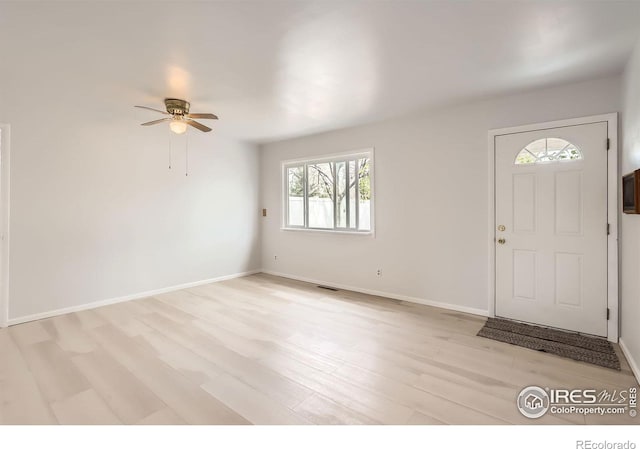 214 2nd St, Frederick, CO 80530 - foyer entrance with light wood-type flooring, visible vents, baseboards, and a ceiling fan