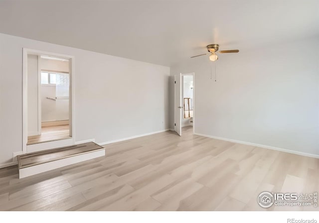 214 2nd St, Frederick, CO 80530 - spare room with baseboards, a ceiling fan, and light wood-style floors