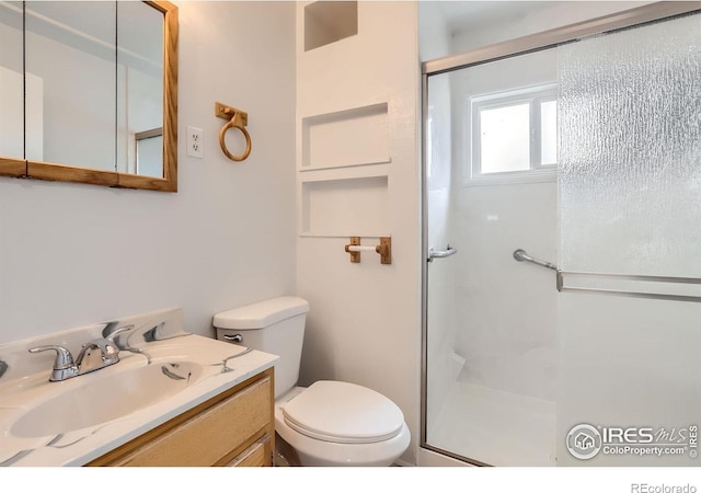 214 2nd St, Frederick, CO 80530 - full bathroom with vanity, toilet, and a shower stall