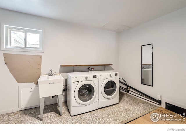214 2nd St, Frederick, CO 80530 - laundry room featuring washer and clothes dryer, laundry area, and a sink