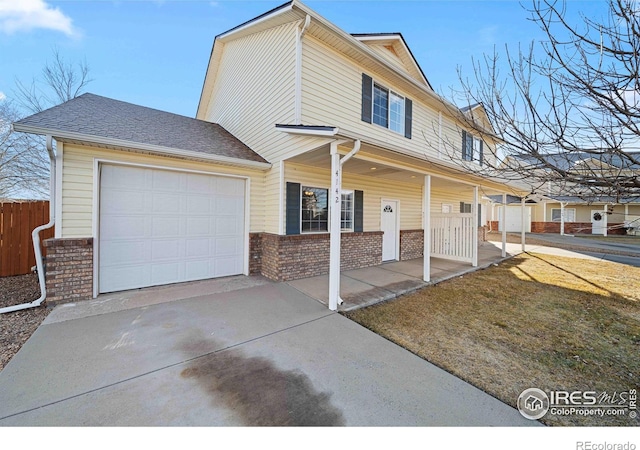 view of front of house with a porch, brick siding, fence, concrete driveway, and an attached garage