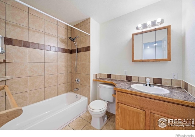 full bathroom featuring toilet, shower / bathing tub combination, tile patterned flooring, and vanity