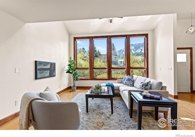 2499 Powderhorn Ln, Boulder, CO 80305 - living room featuring baseboards and wood finished floors