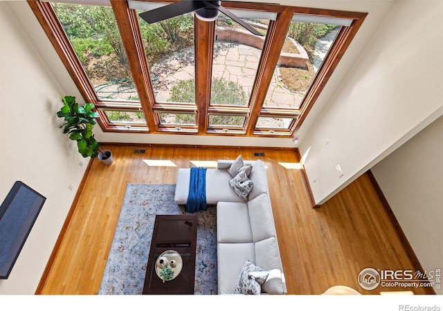 2499 Powderhorn Ln, Boulder, CO 80305 - living area with visible vents, ceiling fan, wood finished floors, and a wealth of natural light
