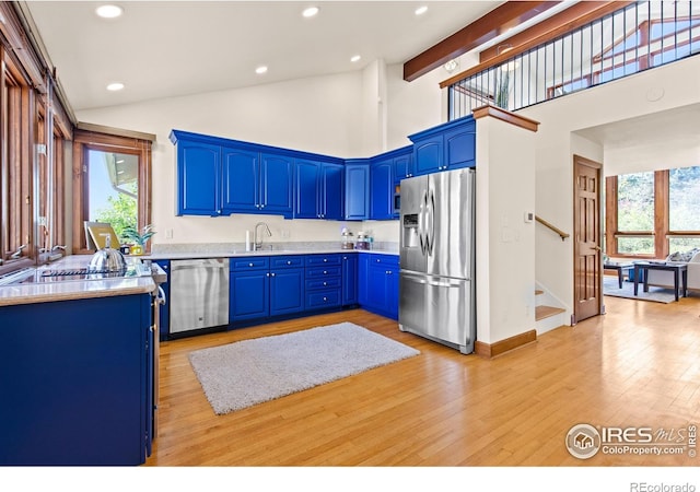 2499 Powderhorn Ln, Boulder, CO 80305 - kitchen featuring stainless steel appliances, blue cabinetry, recessed lighting, and a healthy amount of sunlight