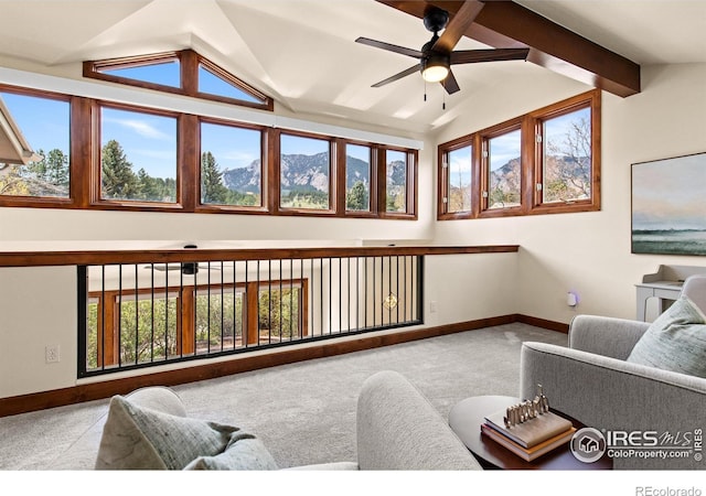 2499 Powderhorn Ln, Boulder, CO 80305 - carpeted living area with baseboards, lofted ceiling with beams, and ceiling fan