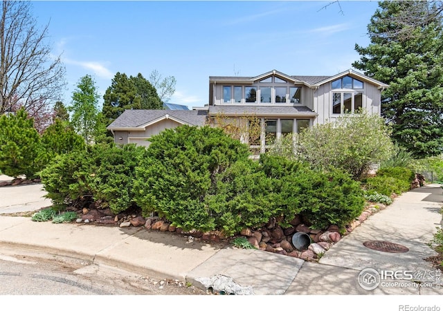 2499 Powderhorn Ln, Boulder, CO 80305 - view of front of property with board and batten siding and a shingled roof