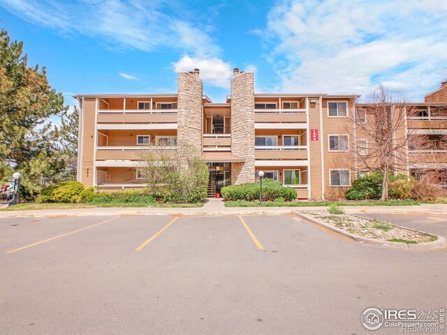 1094 S Dearborn St Unit 301, Aurora, CO 80012 - view of apartment building / complex featuring uncovered parking