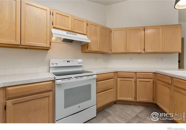 718 Brookhaven Ct, Fort Collins, CO 80525 - kitchen featuring light countertops, electric stove, under cabinet range hood, and light brown cabinetry