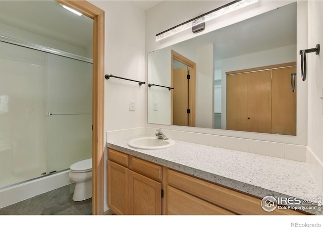 718 Brookhaven Ct, Fort Collins, CO 80525 - bathroom featuring vanity, toilet, and a shower stall