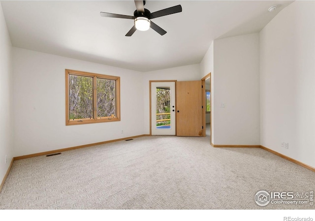 718 Brookhaven Ct, Fort Collins, CO 80525 - carpeted empty room with baseboards, a wealth of natural light, and visible vents