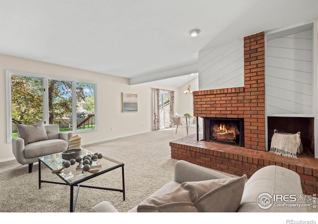 4950 Sundance Sq, Boulder, CO 80301 - carpeted living room featuring a brick fireplace, baseboards, lofted ceiling, and plenty of natural light