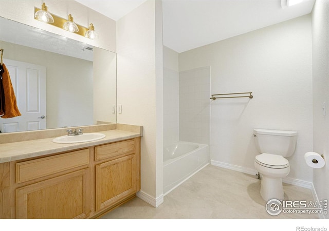full bathroom featuring toilet, baseboards, and vanity