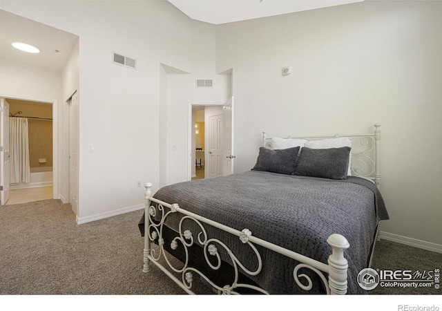 bedroom with carpet floors, baseboards, and visible vents