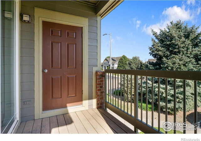 property entrance with a balcony