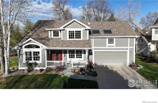 back of property featuring a lawn, covered porch, a shingled roof, and concrete driveway