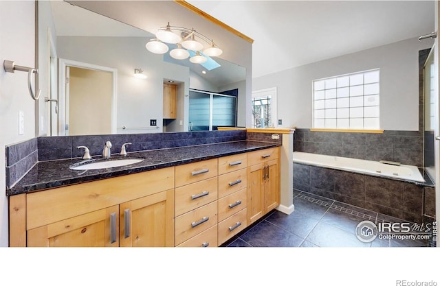 bathroom with tile patterned flooring, a shower with shower door, vanity, lofted ceiling, and a bath